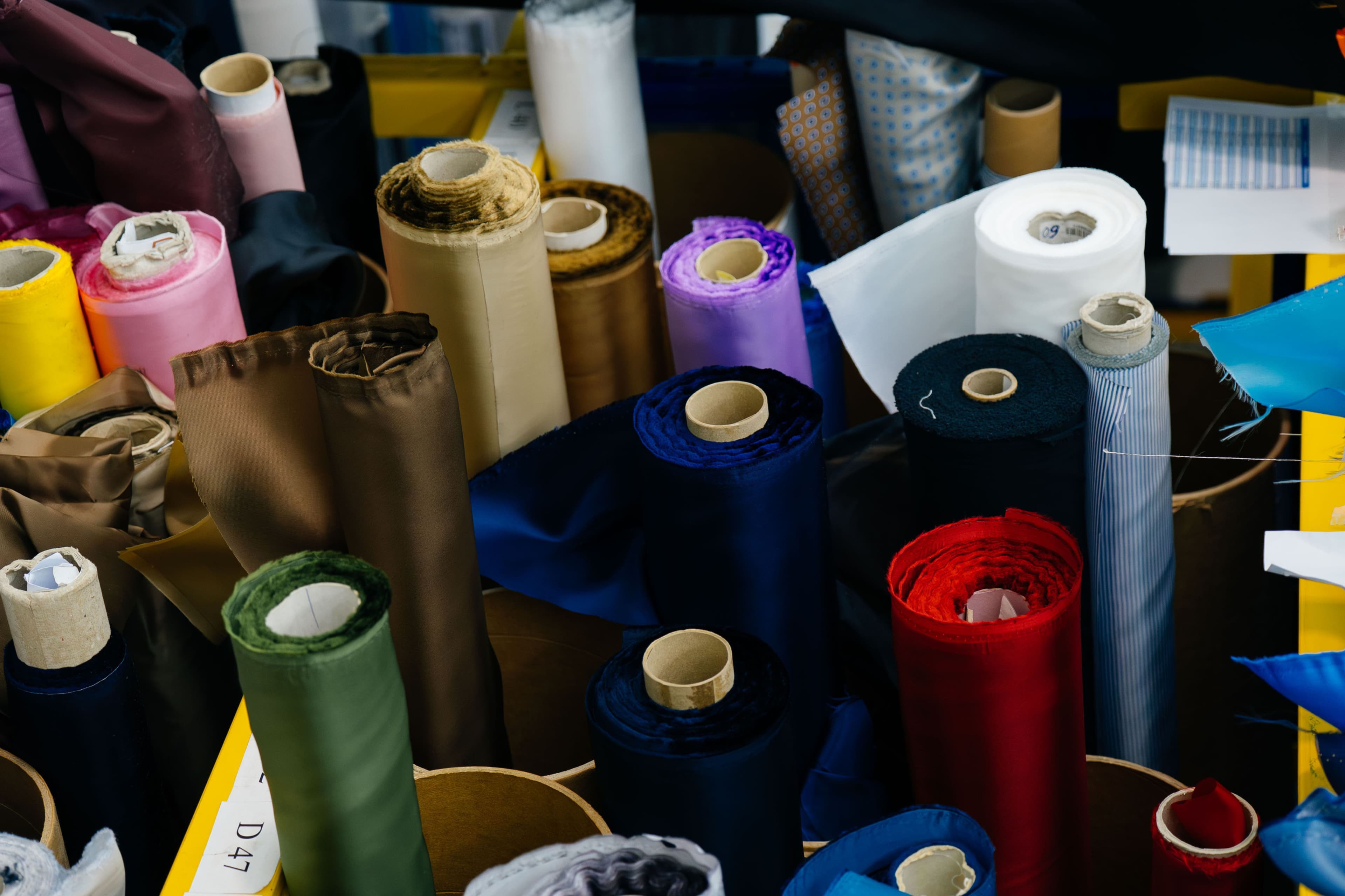 Rolls of European tailoring cloth in the materials store